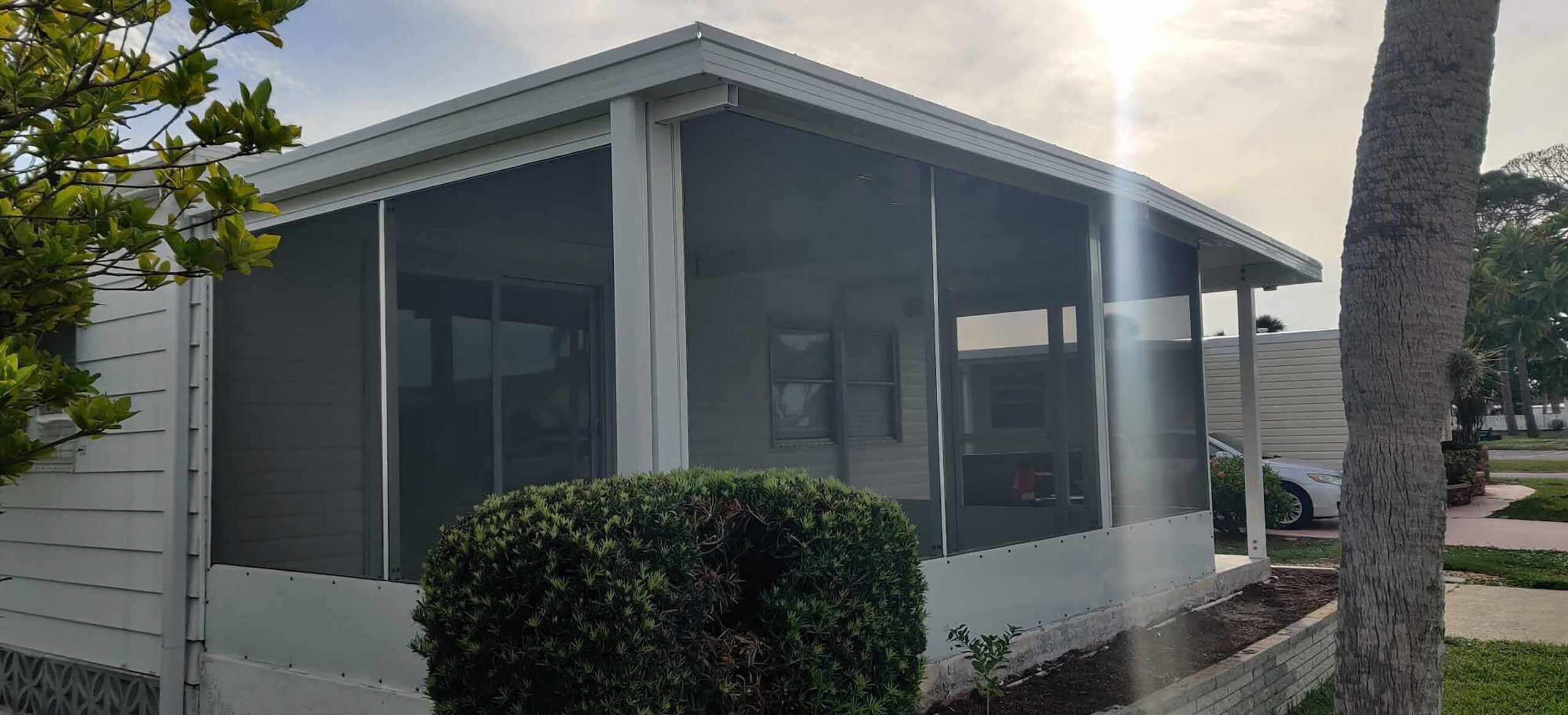 Finished screened lanai with outdoor furniture and paver floor